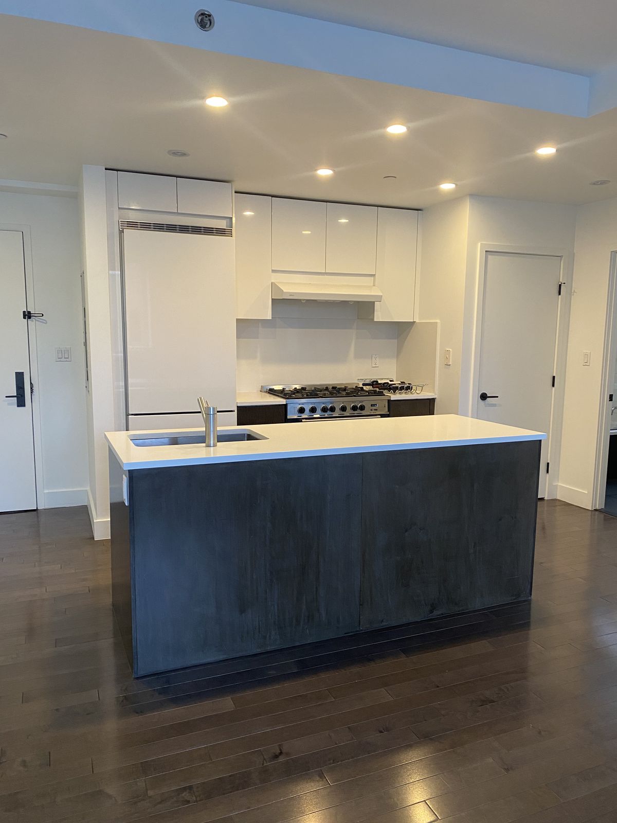 White quartz kitchen countertop with integrated backsplash