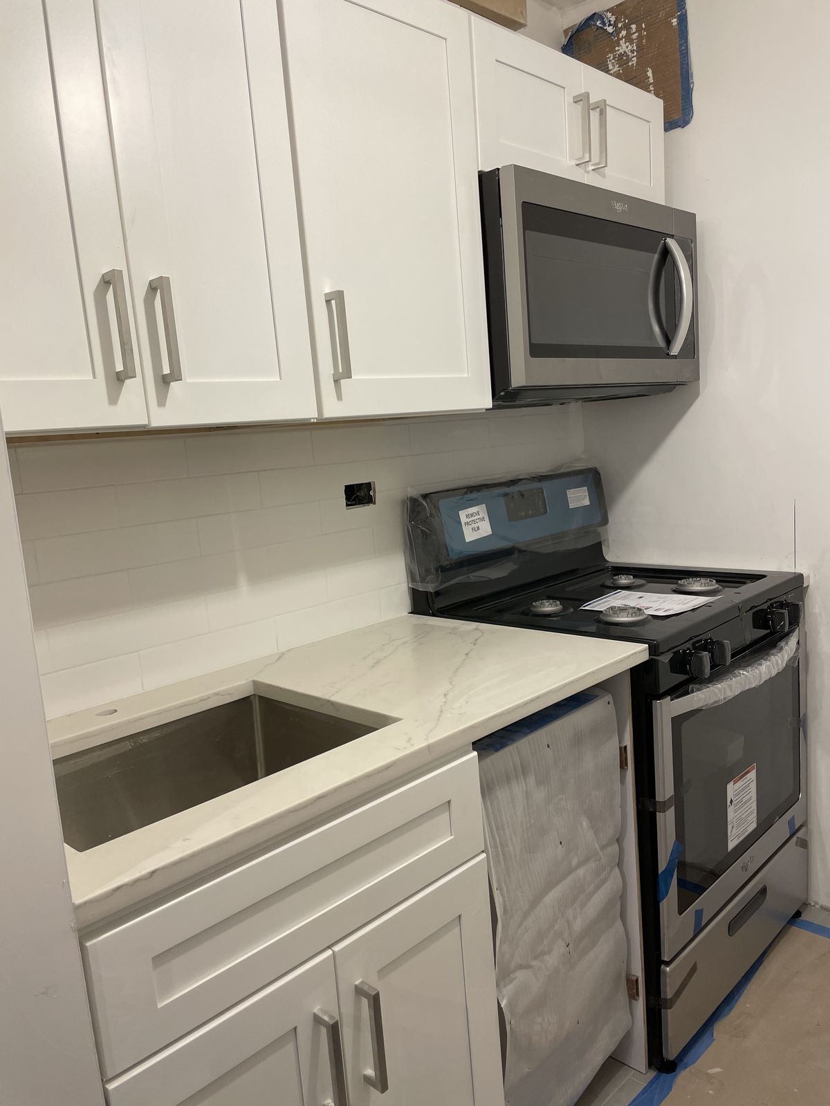 Quartz countertop with waterfall edge on kitchen island