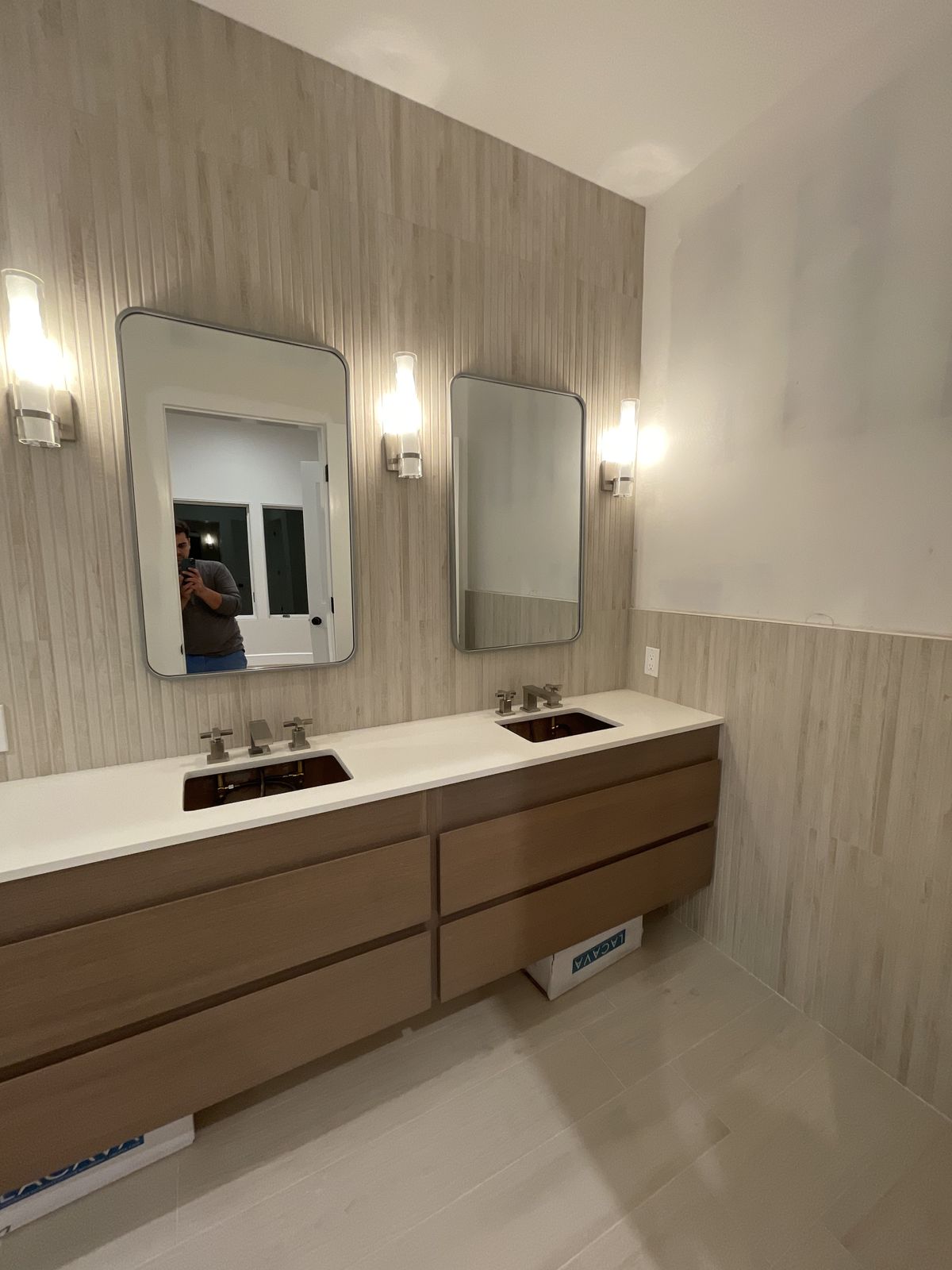 Custom walk-in closet interior with wood veneer finish and chrome hardware
