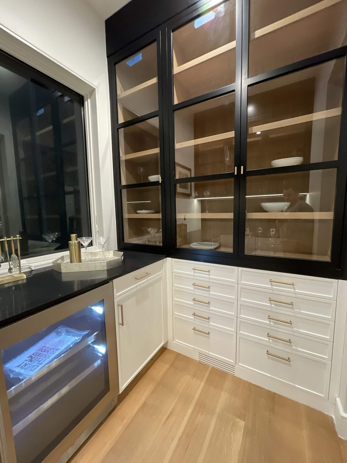 Custom laundry room shelving above washer and dryer