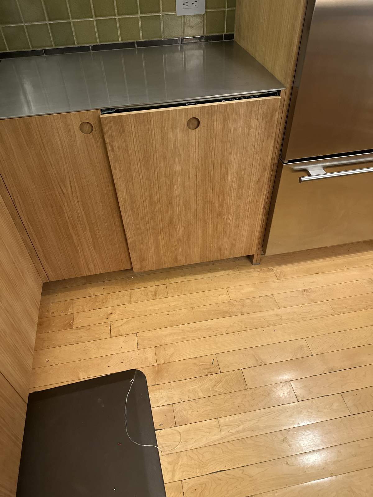 Built-in mudroom storage with cubbies, bench seating, and coat hooks