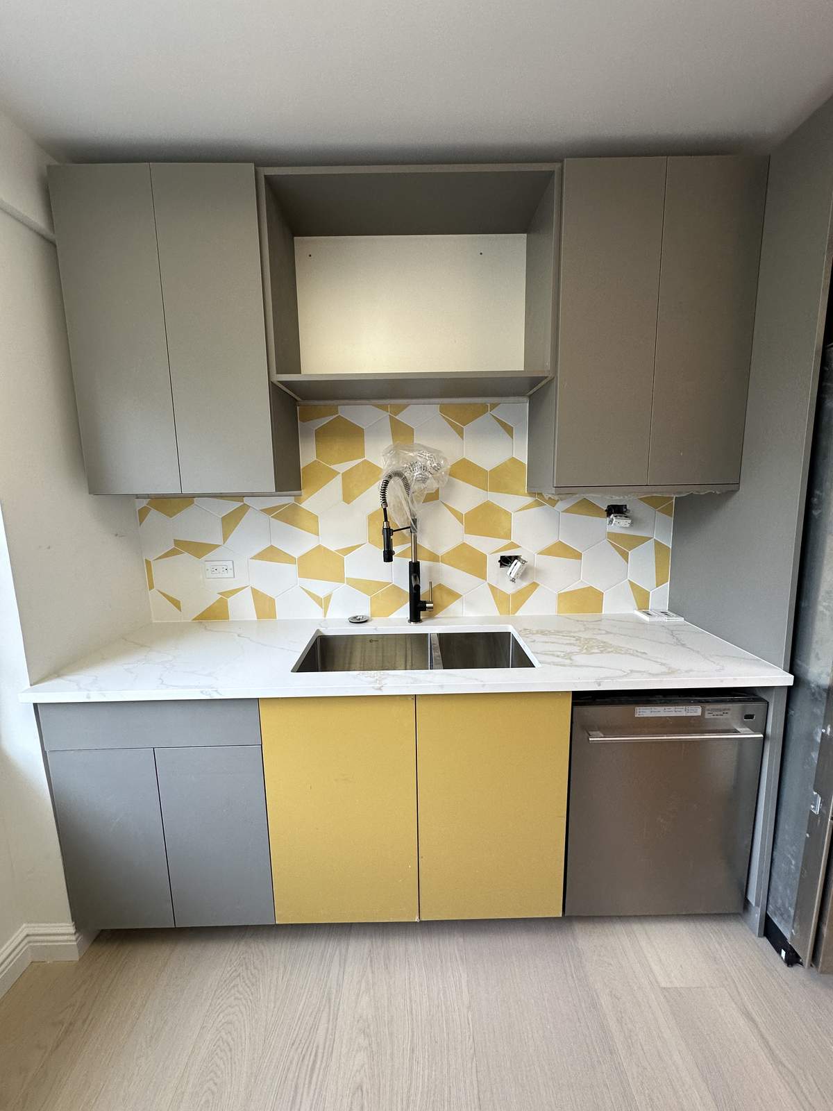 Custom cabinet installation with precision fitting and hardware