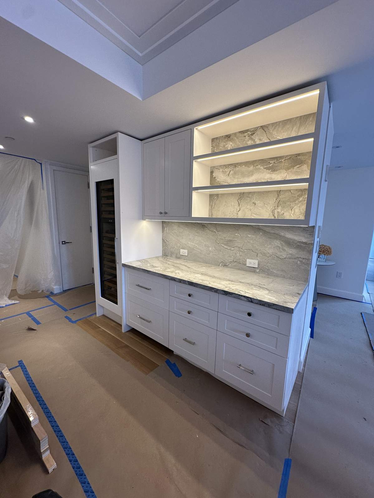 Custom white cabinetry installation with crown molding detail