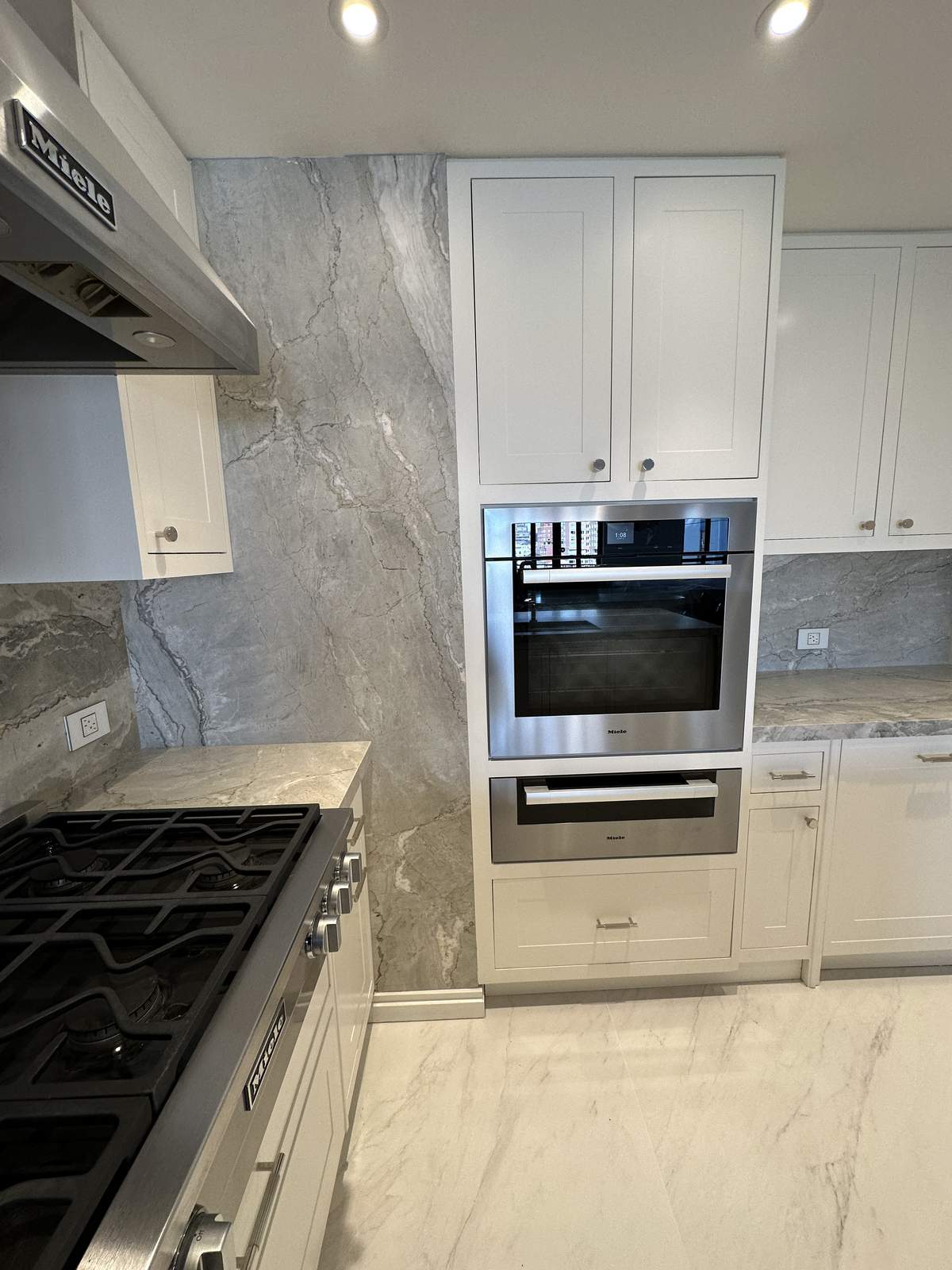 Custom vanity cabinet with dual sinks and stone countertop