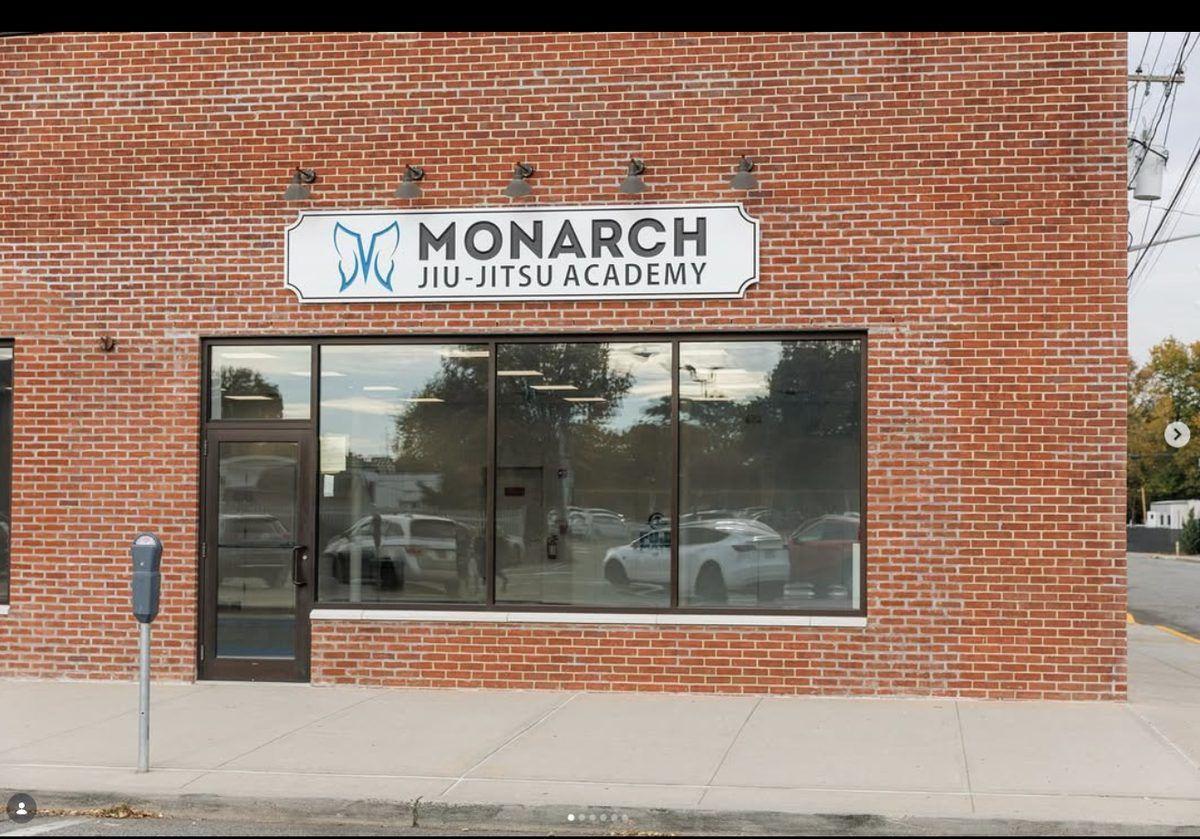 Commercial storefront buildout for fitness facility featuring custom signage and full glass facade