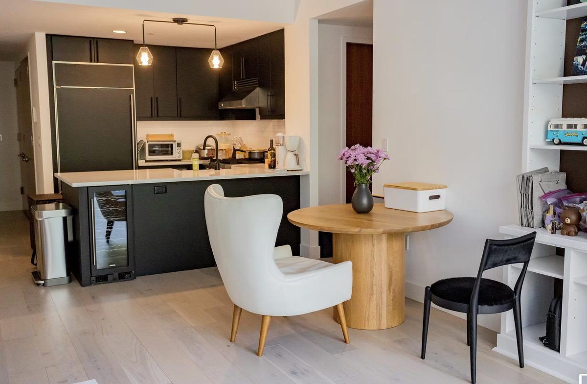 Open kitchen and dining area after gut renovation converting UWS studio to one-bedroom