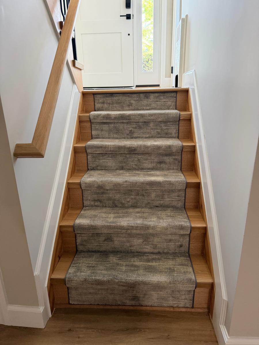 Completed oak stairs with custom carpet runner