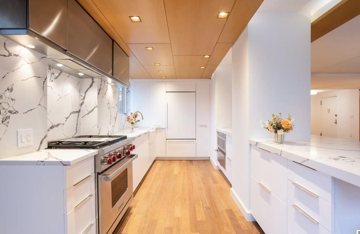 Modern bathroom renovation with custom tile and glass shower in Hudson Square apartment